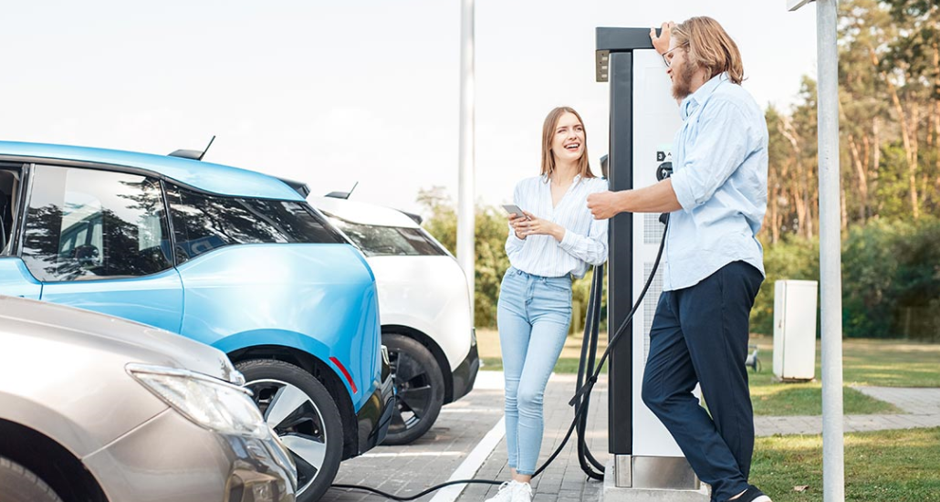 People charging a car