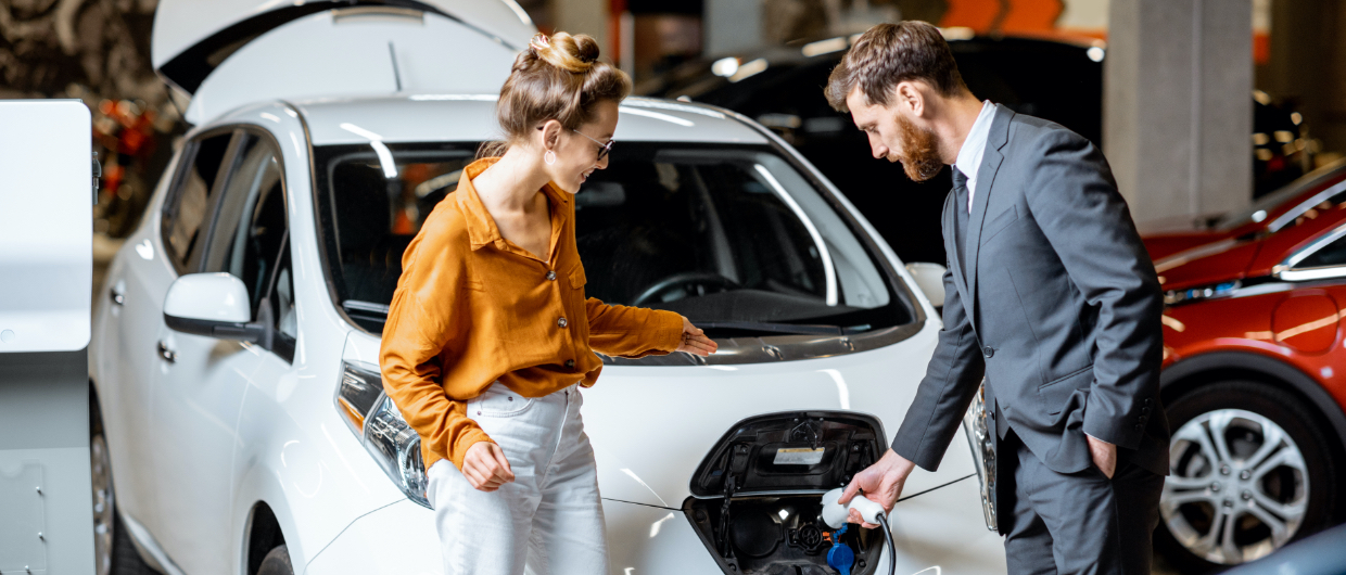 Couple charging car